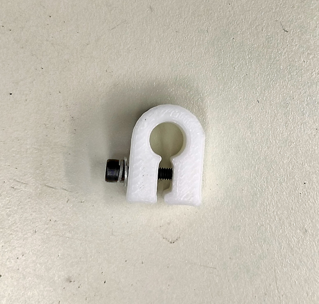 1/8" Hose barb clamp for airline tubing.