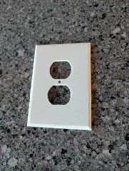 Oversized standard outlet cover plate