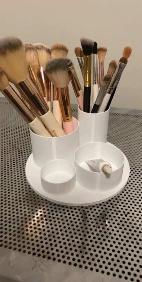 Makeup Brushes in Bust Sculpture Holder · Free Stock Photo