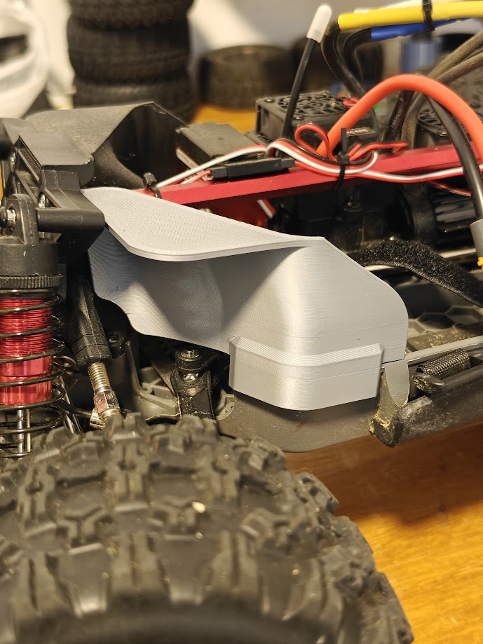 MJX 10208 chassis dirt shield