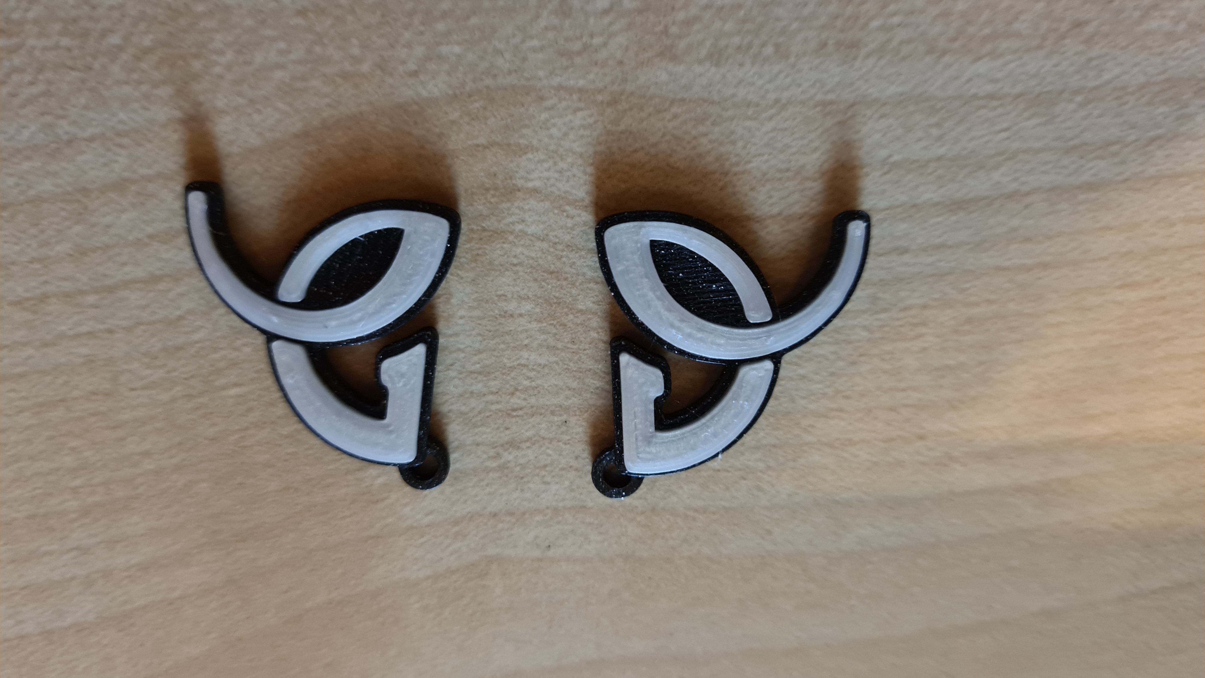 Novak Djokovic logo earrings