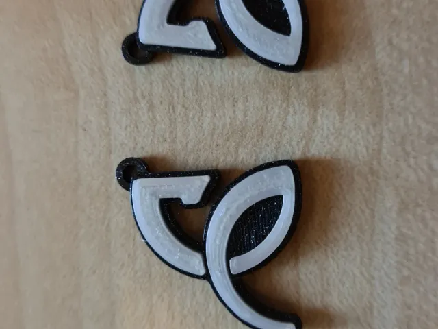 Novak Djokovic logo earrings
