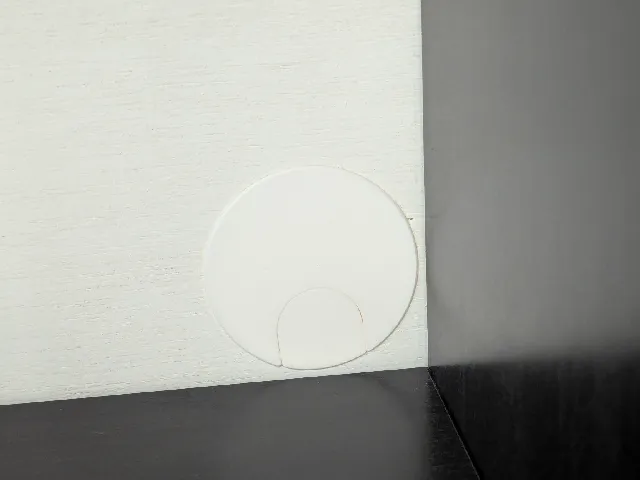 Furniture breakaway wire hole cap
