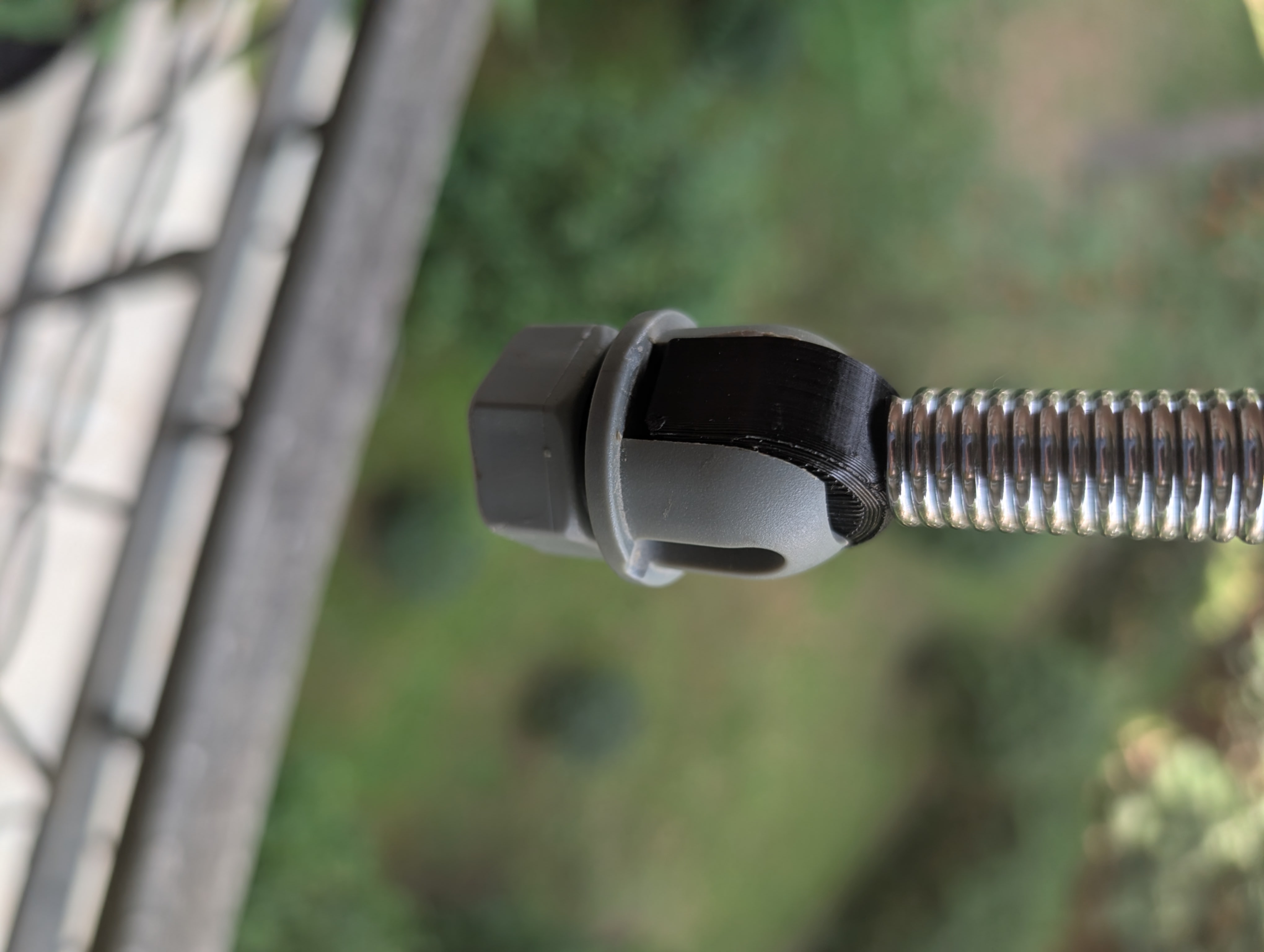 Ironing board spring cable holder