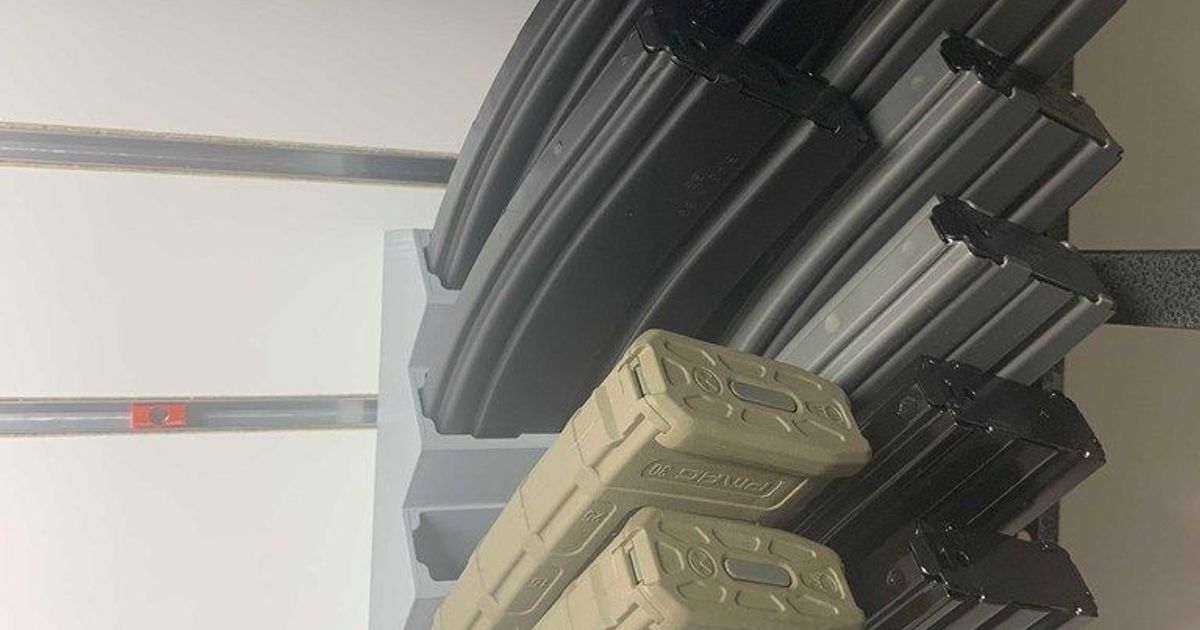 AR15 mag holder with slatwall mount by Szwalkiewicz Download free STL