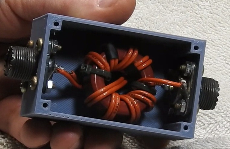 Enclosure for a 1:1 common mode choke