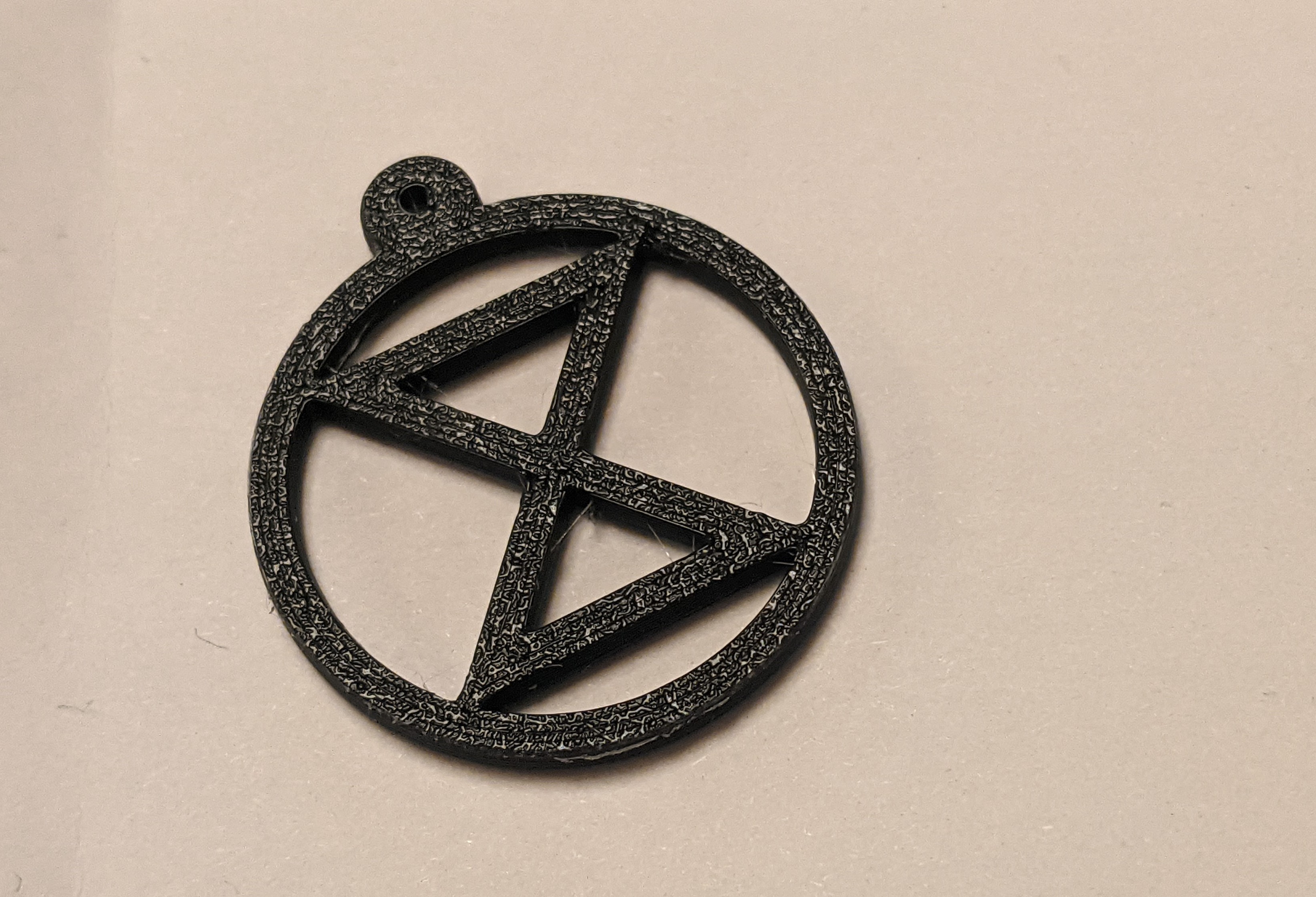 extinction symbol earring