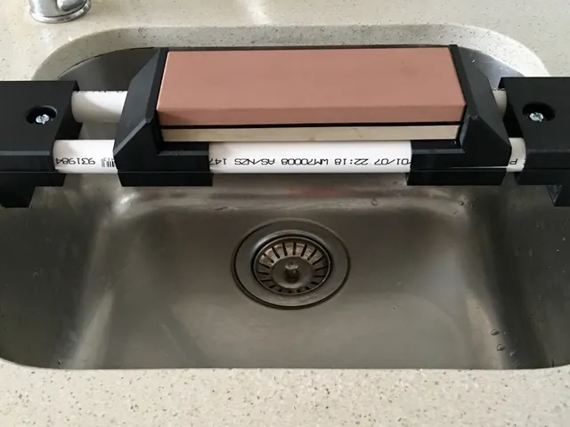 Sharpening stone sink bridge
