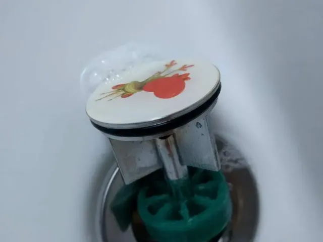 Sink drain plug hair sieve