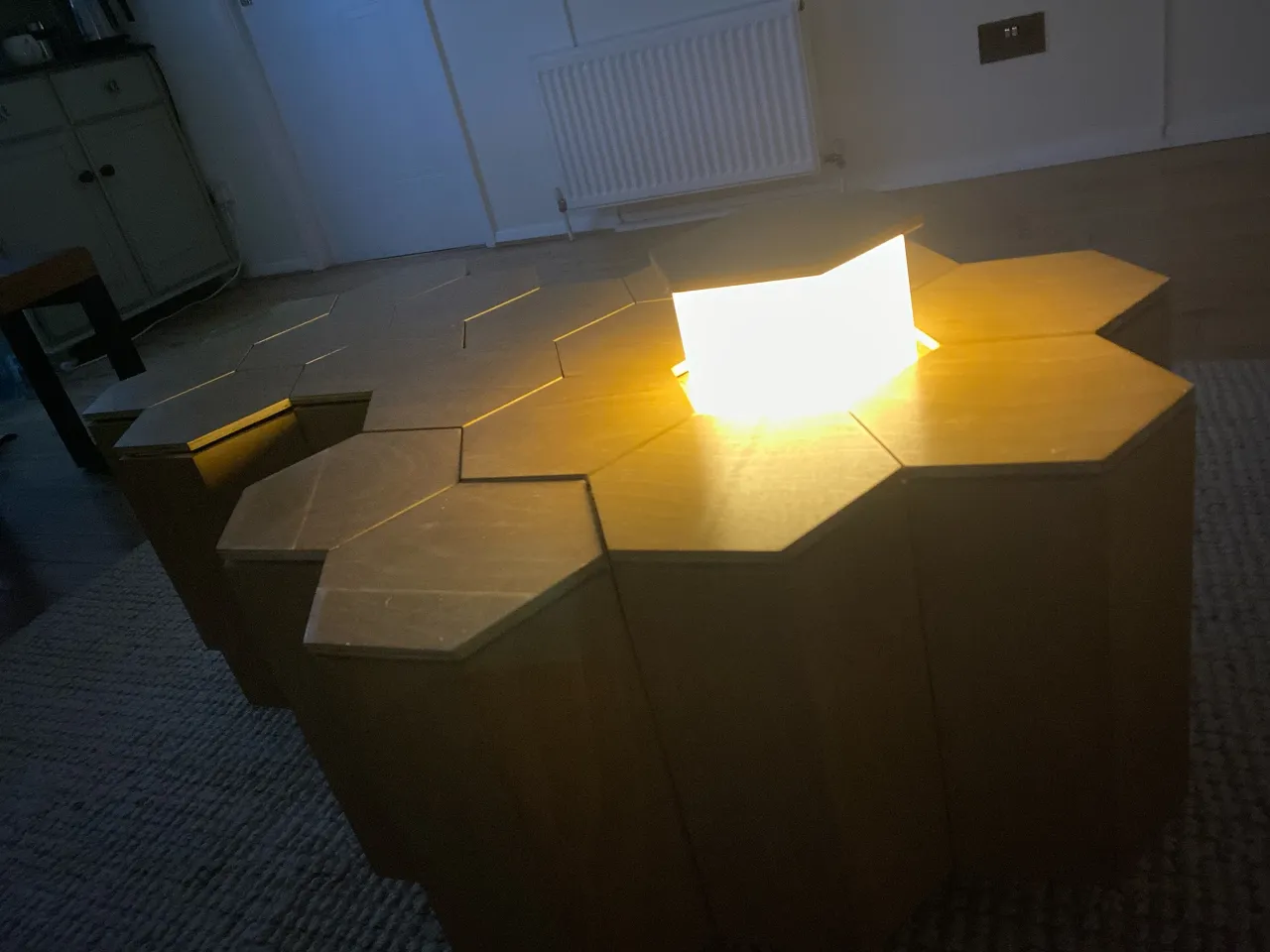 Modular honeycomb coffee table with built-in storage and pop-up