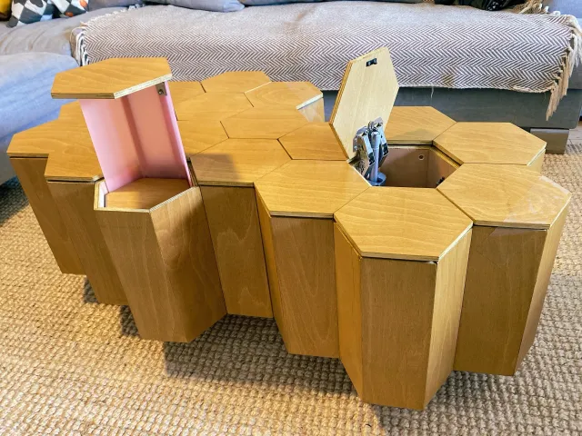 Modular honeycomb coffee table with built-in storage and pop-up light