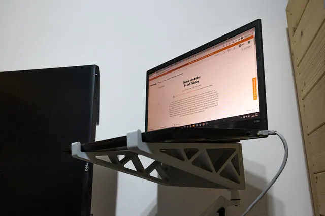 Notebook on monitor mount