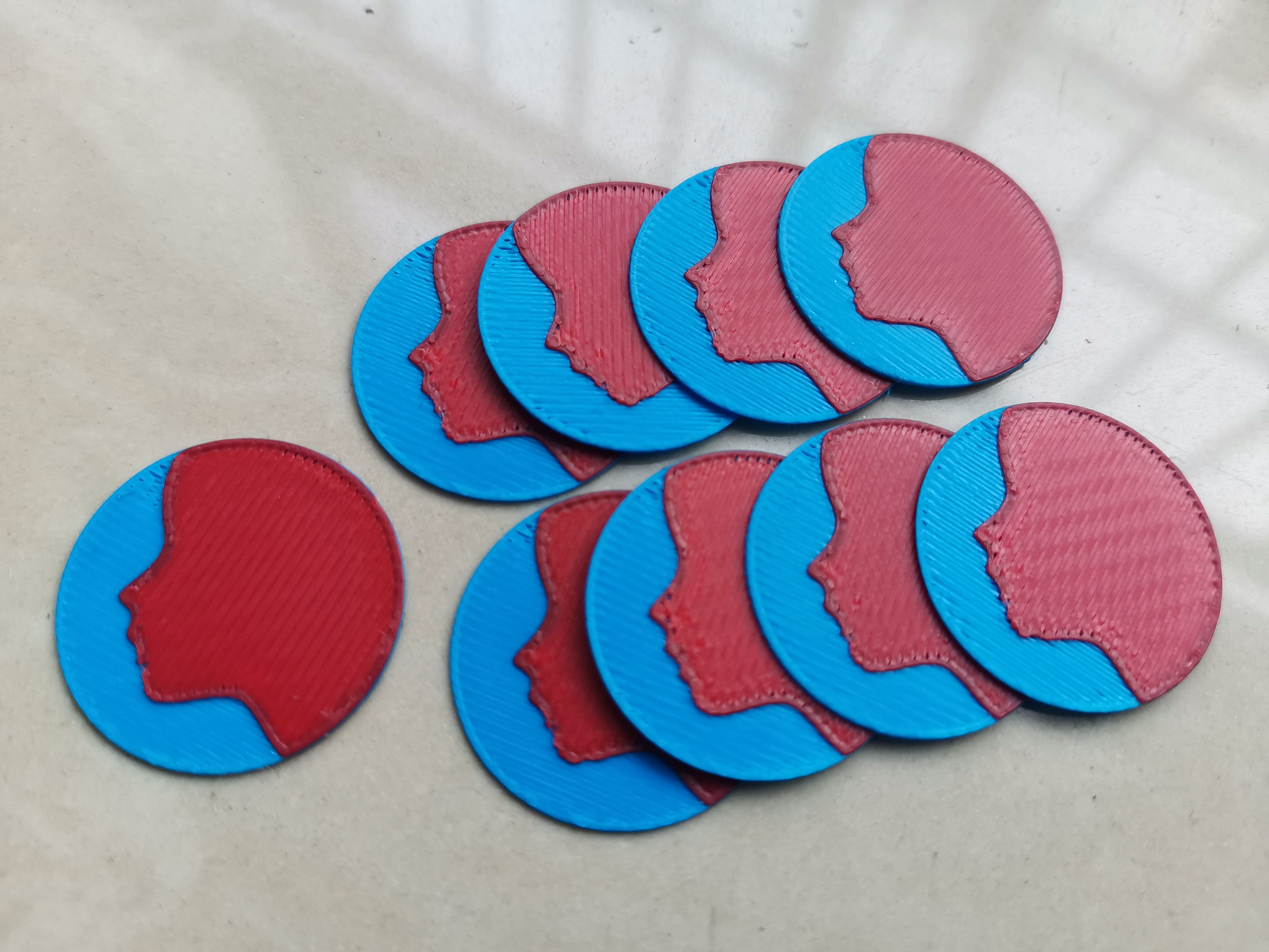 Multicolor coin with a face
