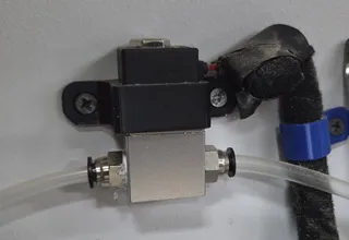 Bracket to mount solenoid valve for laser air assist
