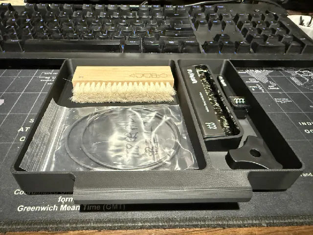 Under-turntable accessory tray