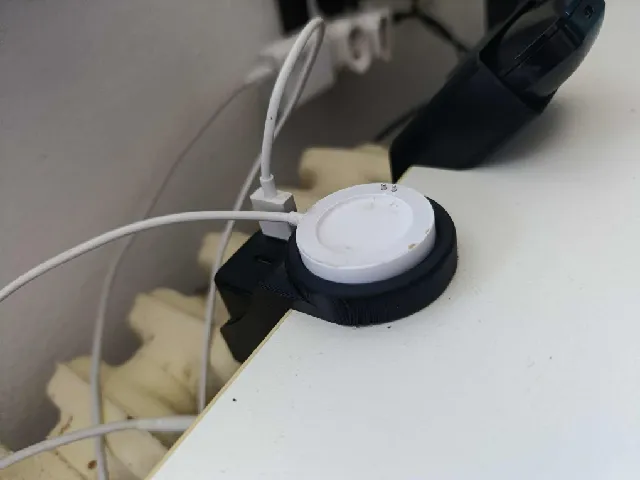 Smartwatch charger holder with space for storing the power adapter