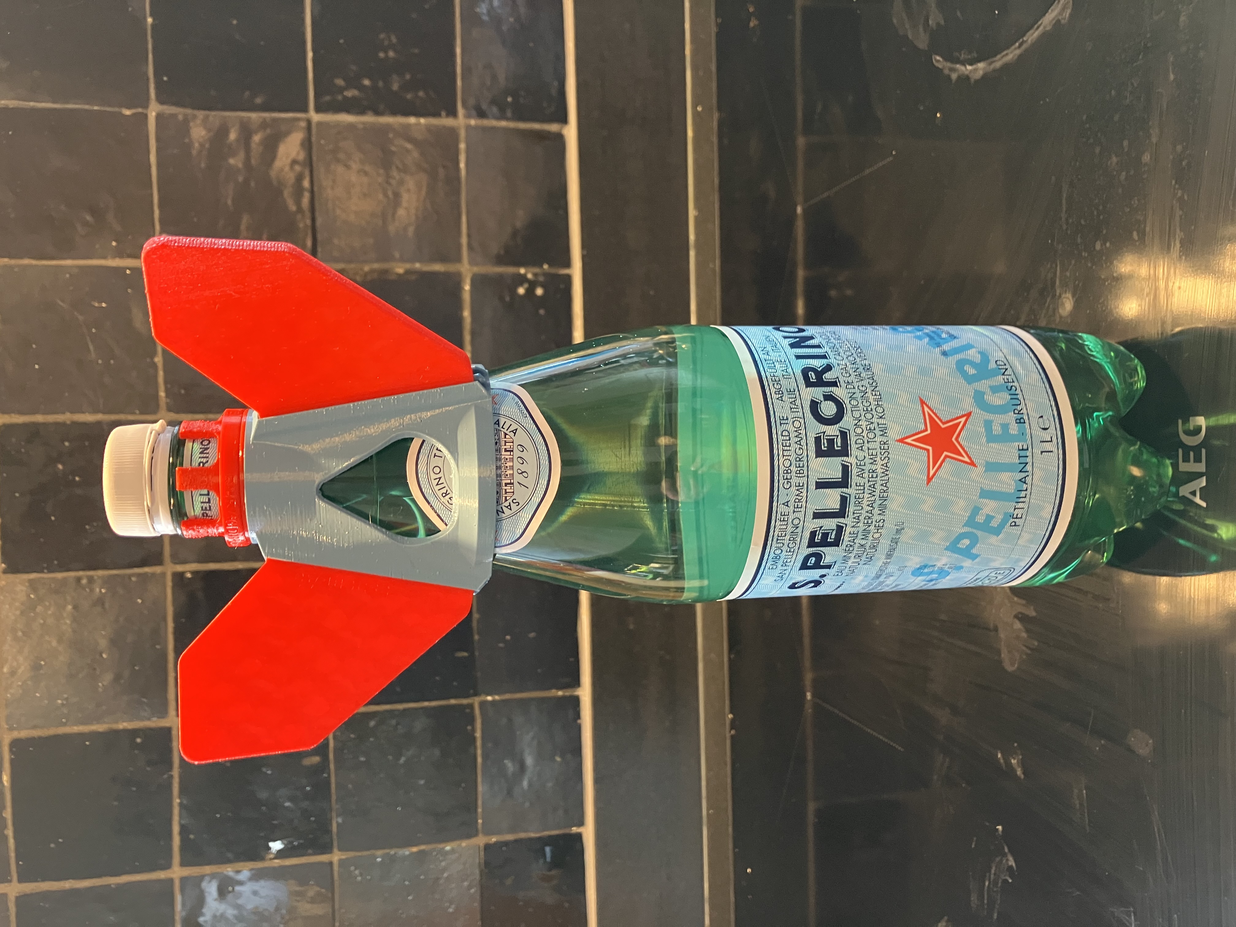 Water rocket tail fin collar for alternative bottles