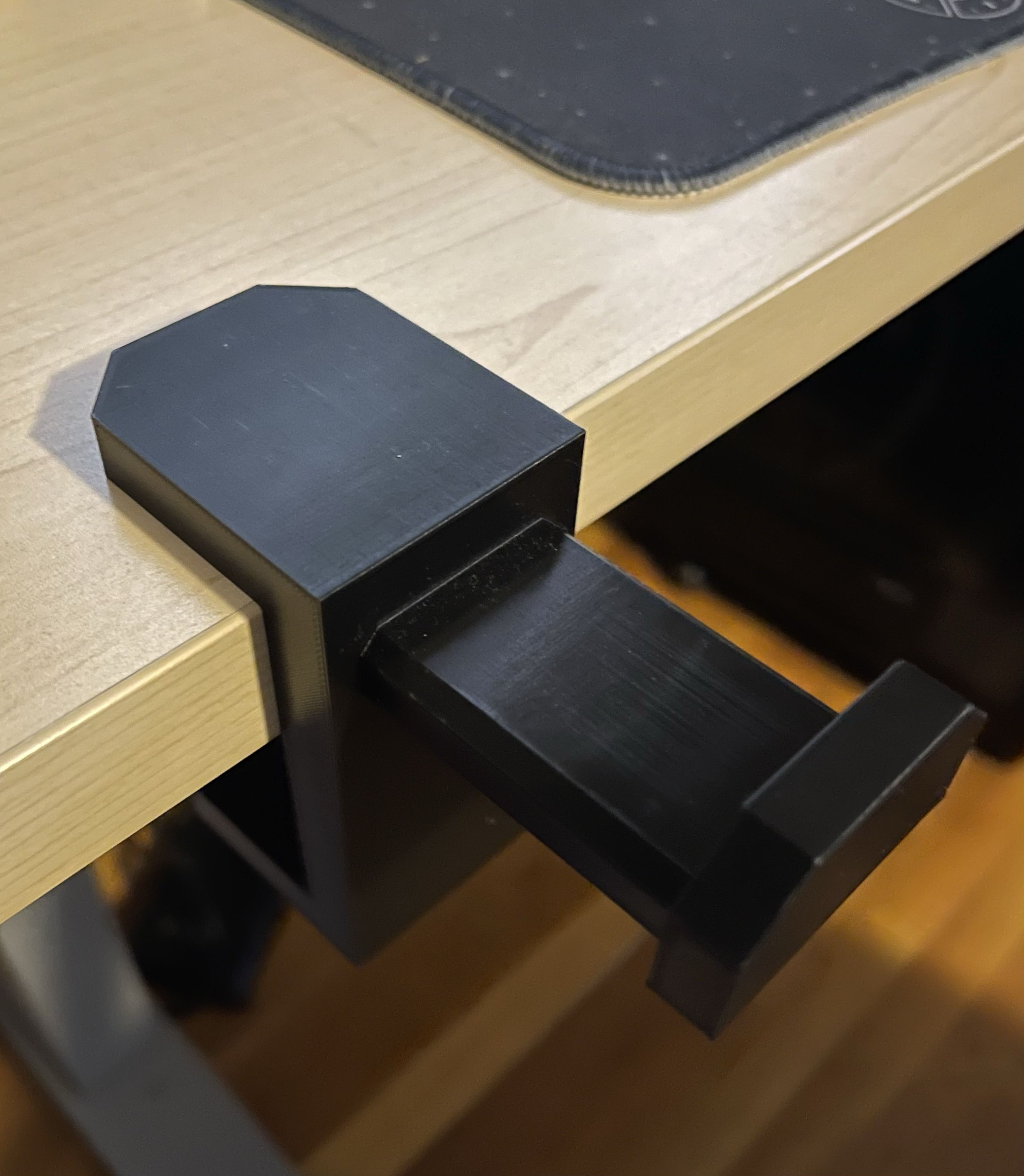 Ergonomic desk mounted headphone holder