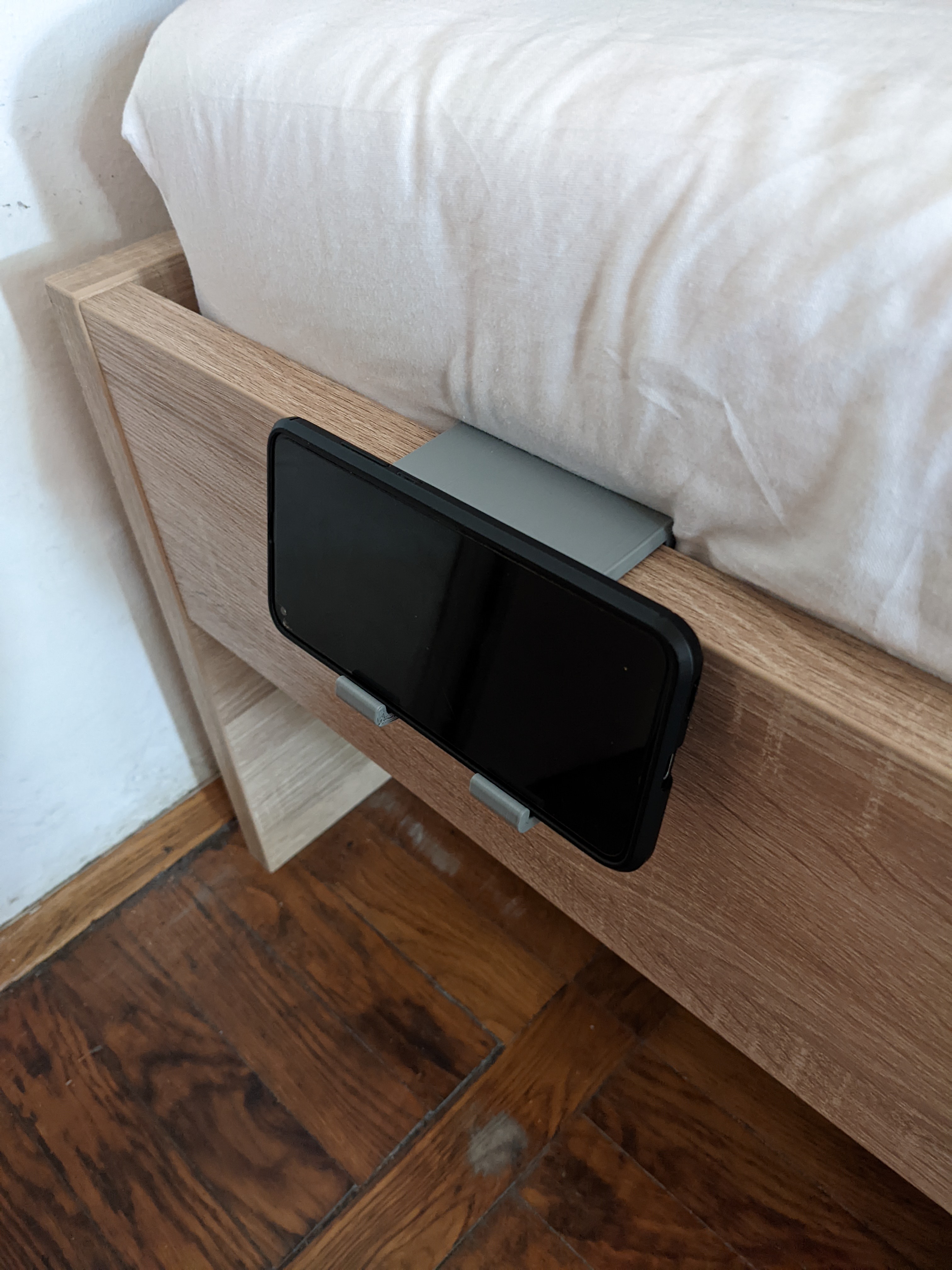 Bed frame phone holder