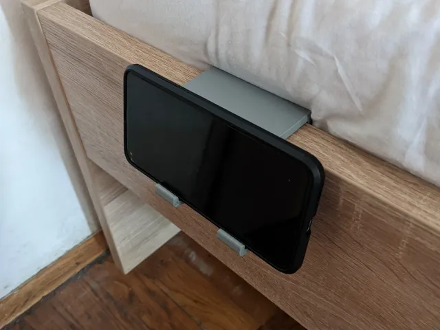 Bed frame phone holder