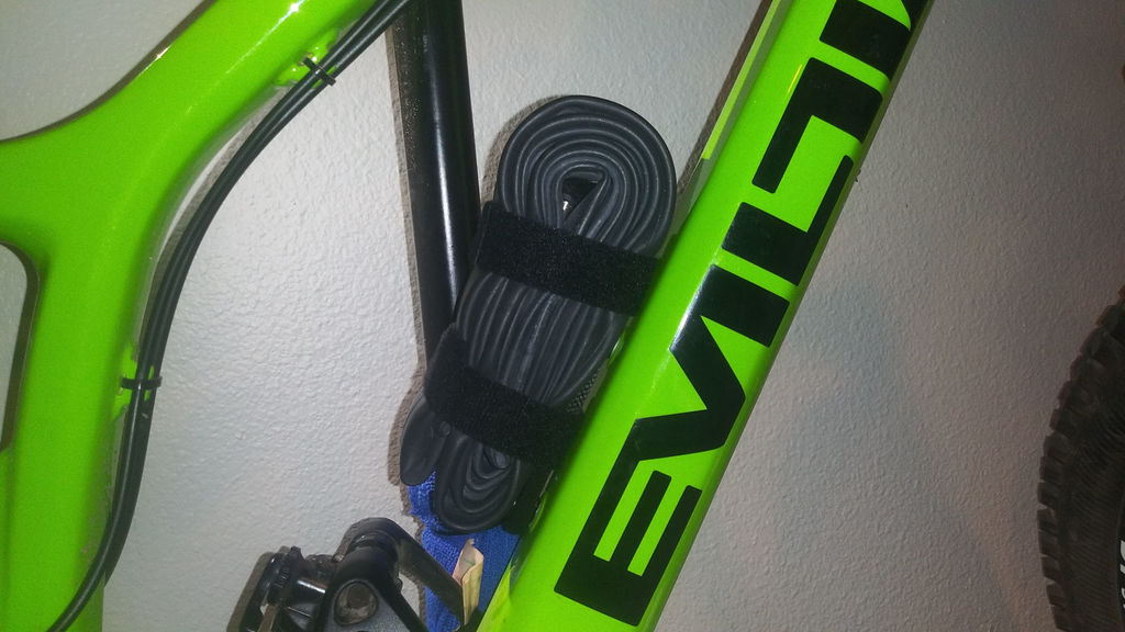 Rail that Bolts to a Bike's Water Bottle Mount to Strap Stuff To