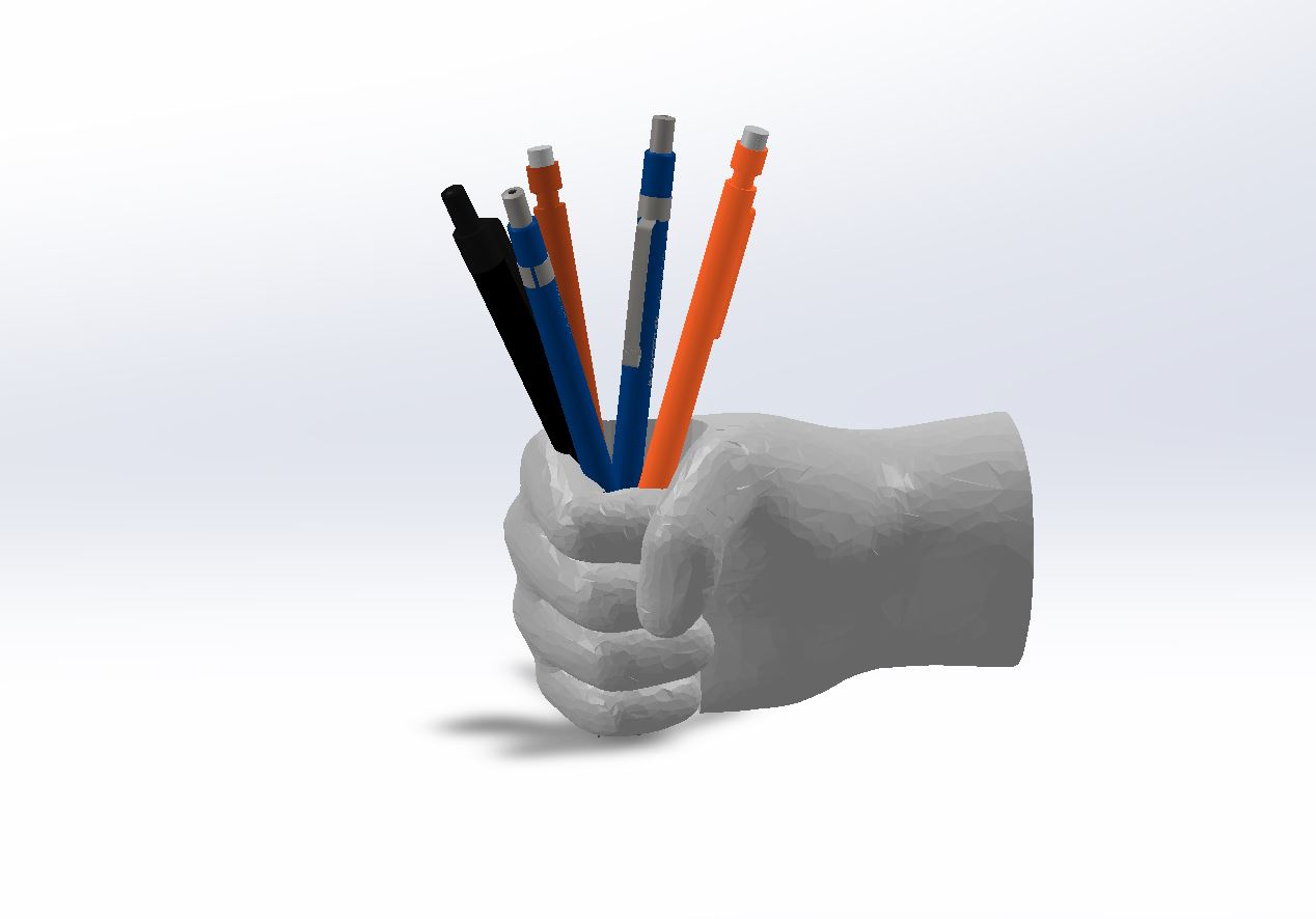 Hand holding pens, pen cup
