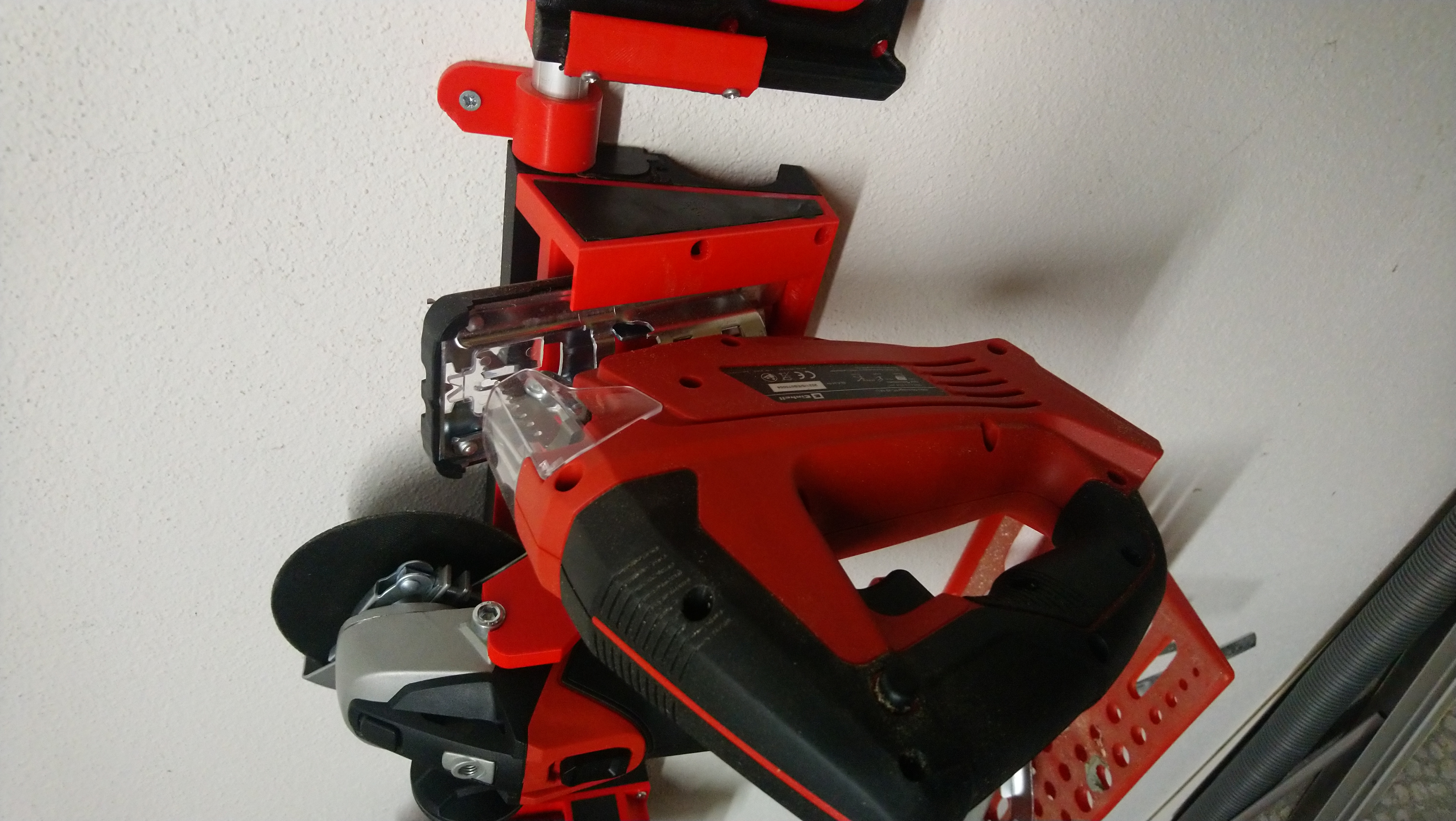 Jigsaw holder for modular wallmount