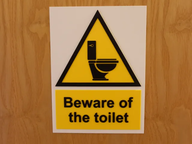 Beware of the toilet sign