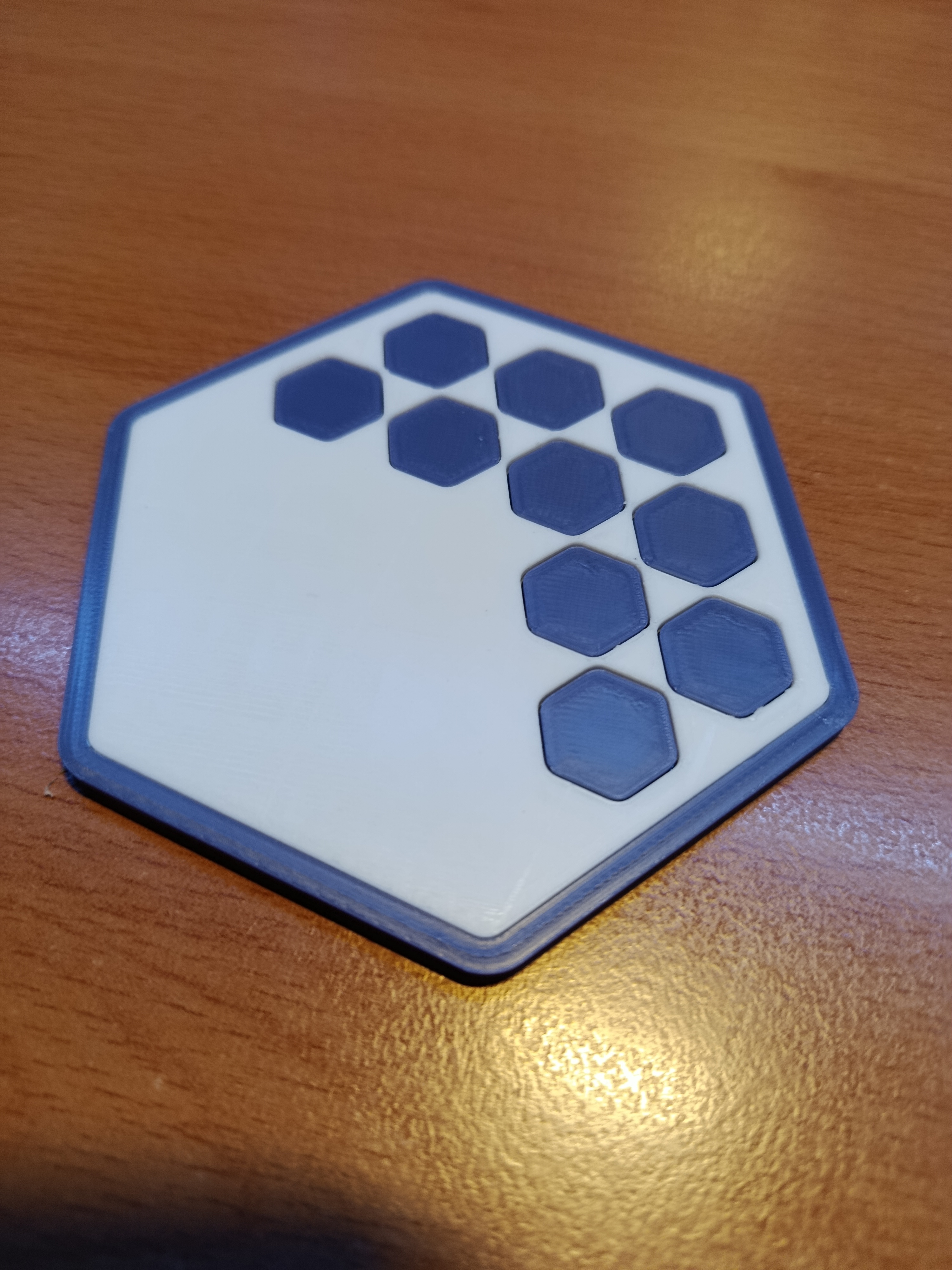 Hexagonal coaster with hexagonal pattern