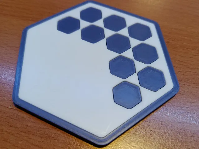 Hexagonal coaster with hexagonal pattern