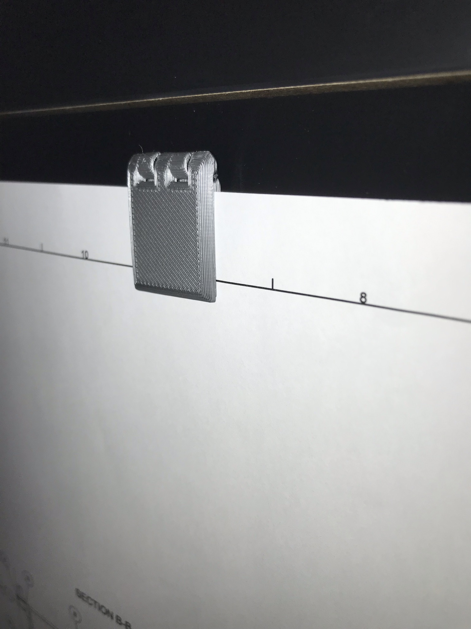 Wall-mounted magnetic paper clips
