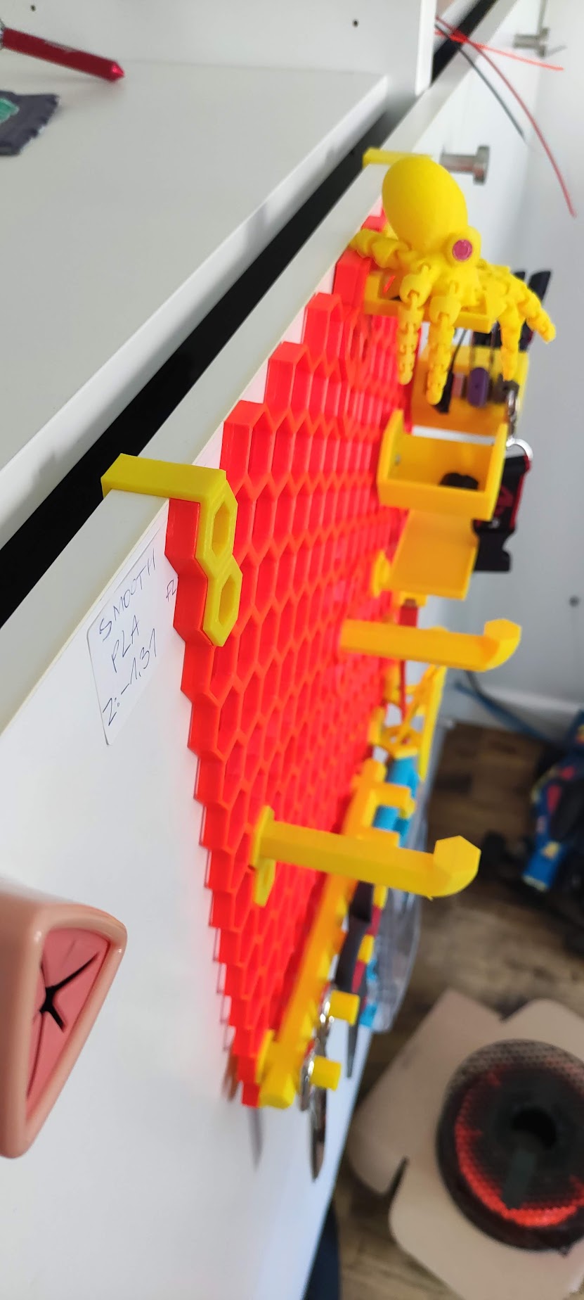Honeycomb storage wall door holder