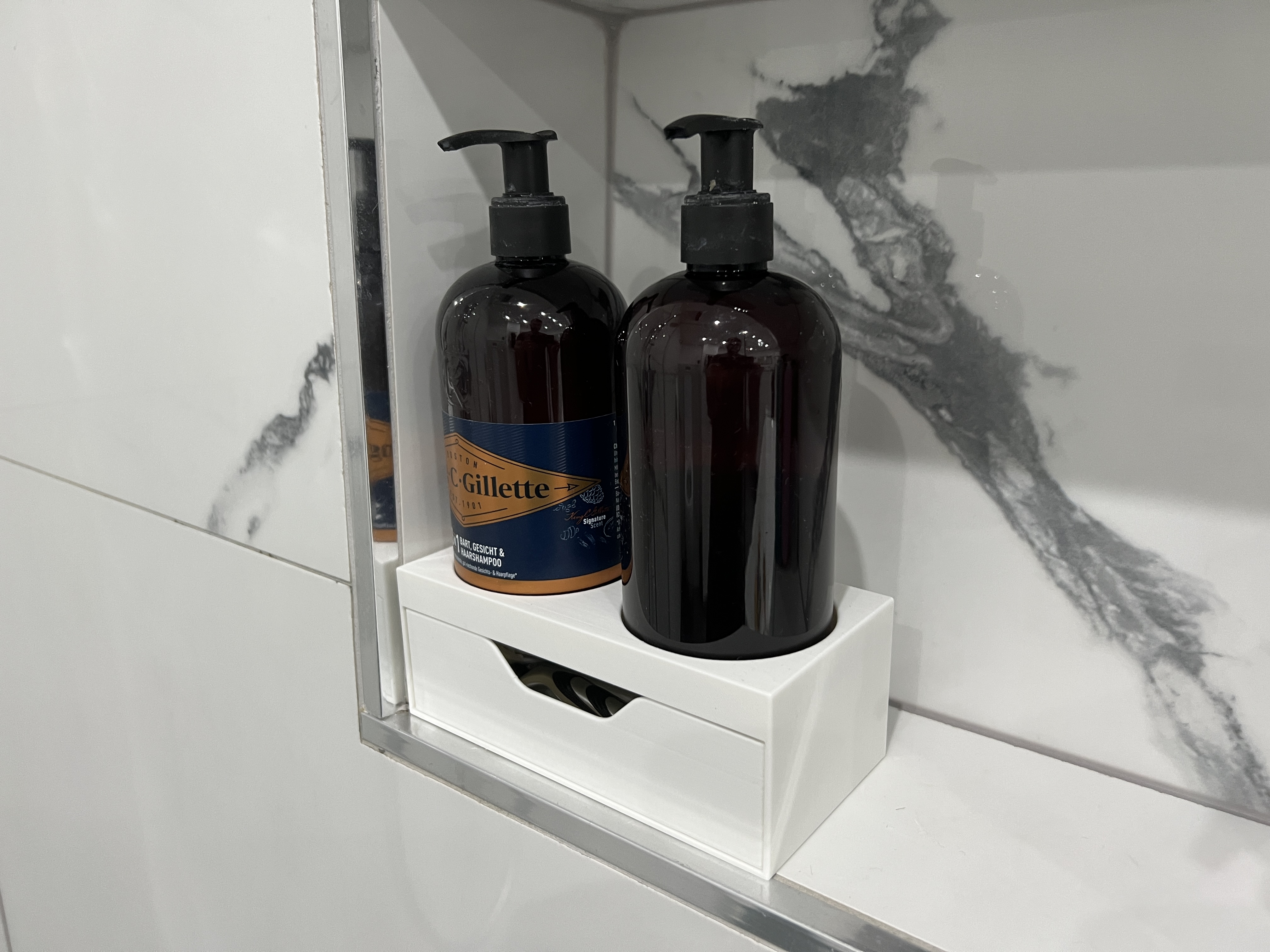 Shampoo holder with a drawer for razors