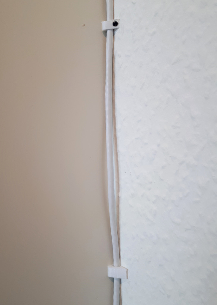 Ethernet cable clip for mounting next to furniture