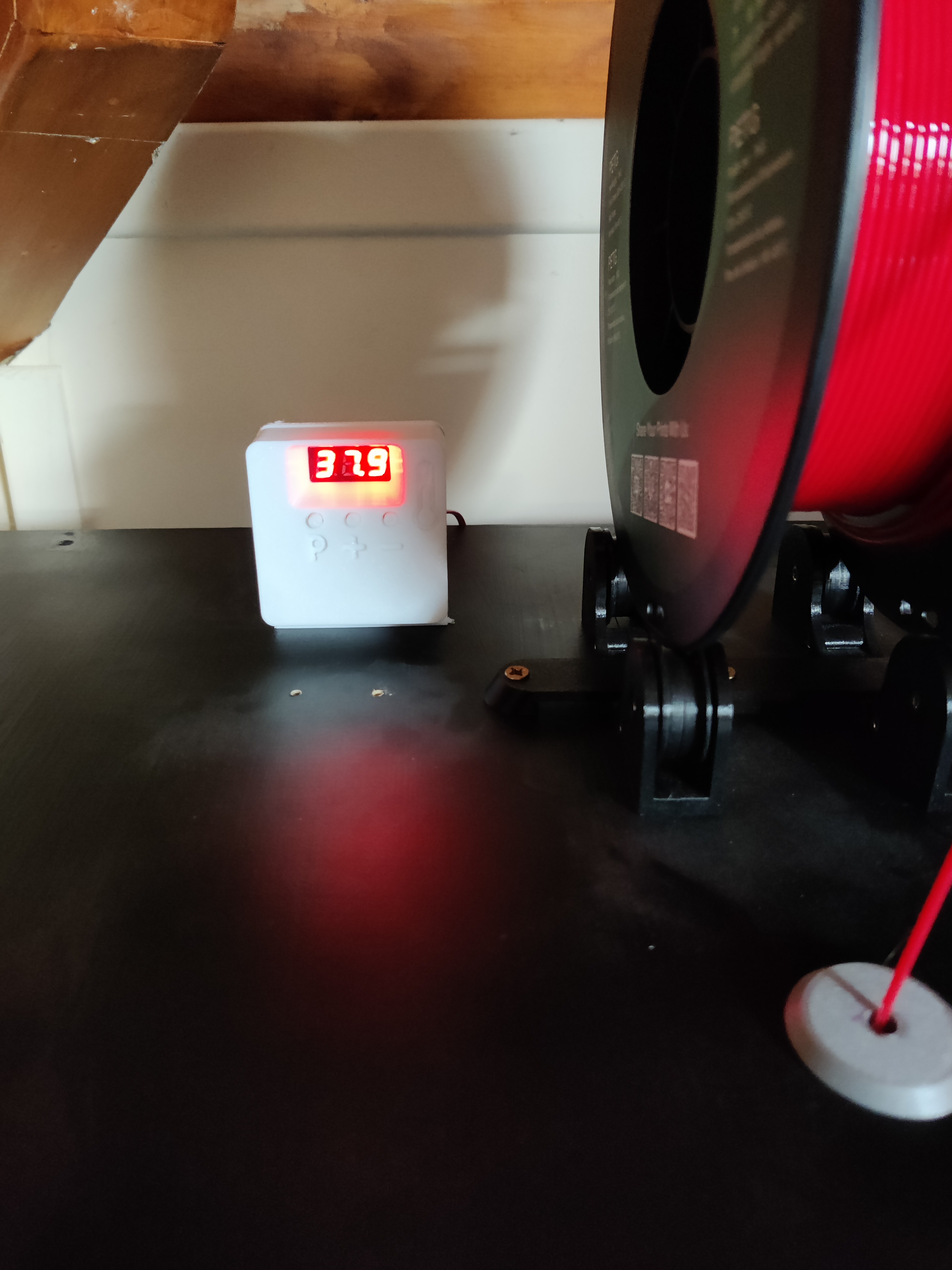 Temperature-controlled fan for enclosure.
