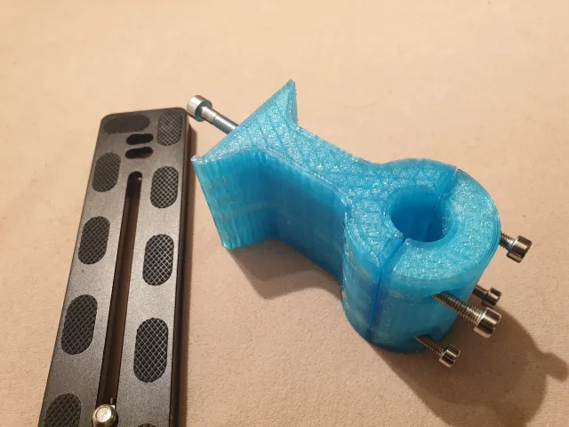 Adapter to mount a binocular to an Arca Swiss quick adapter plate for use on a tripod