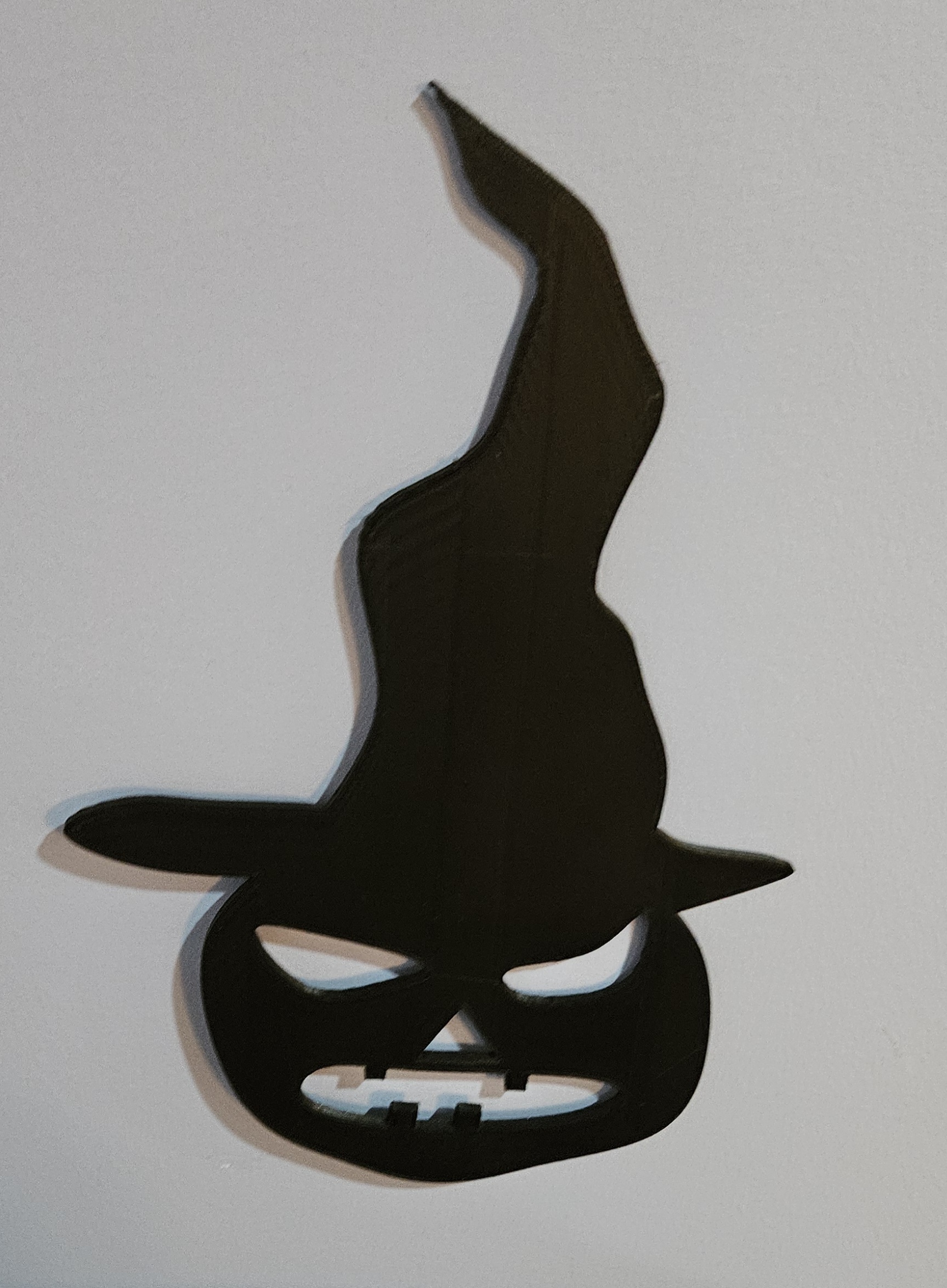 pumpkin with witch hat wall art.
