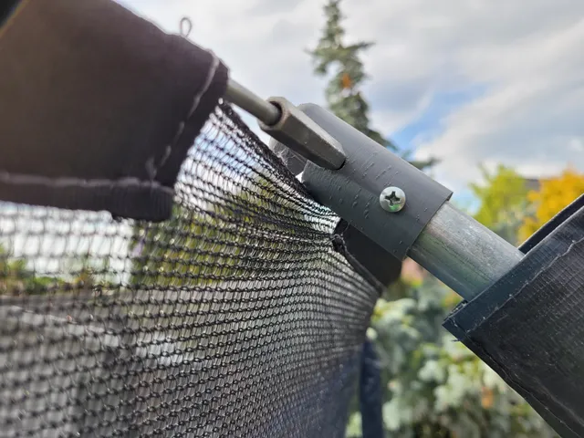 Trampoline net holder