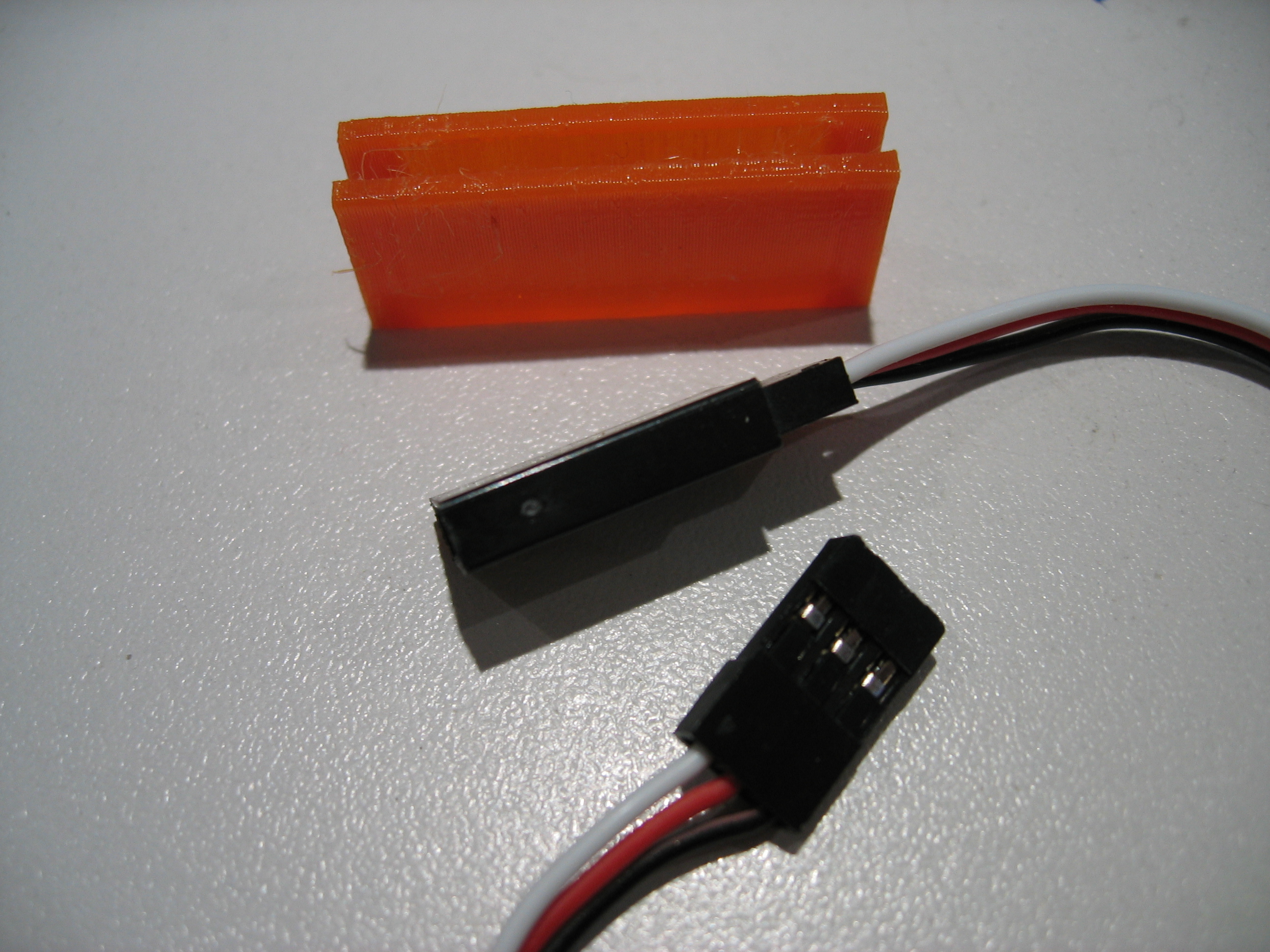 RC servo connector retaining clip by LowZ Download free STL model