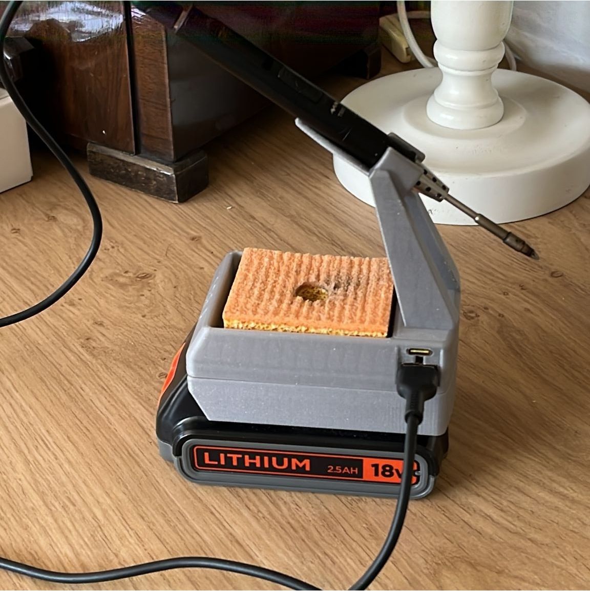 TS80 soldering iron stand on Black and Decker Li ion battery by