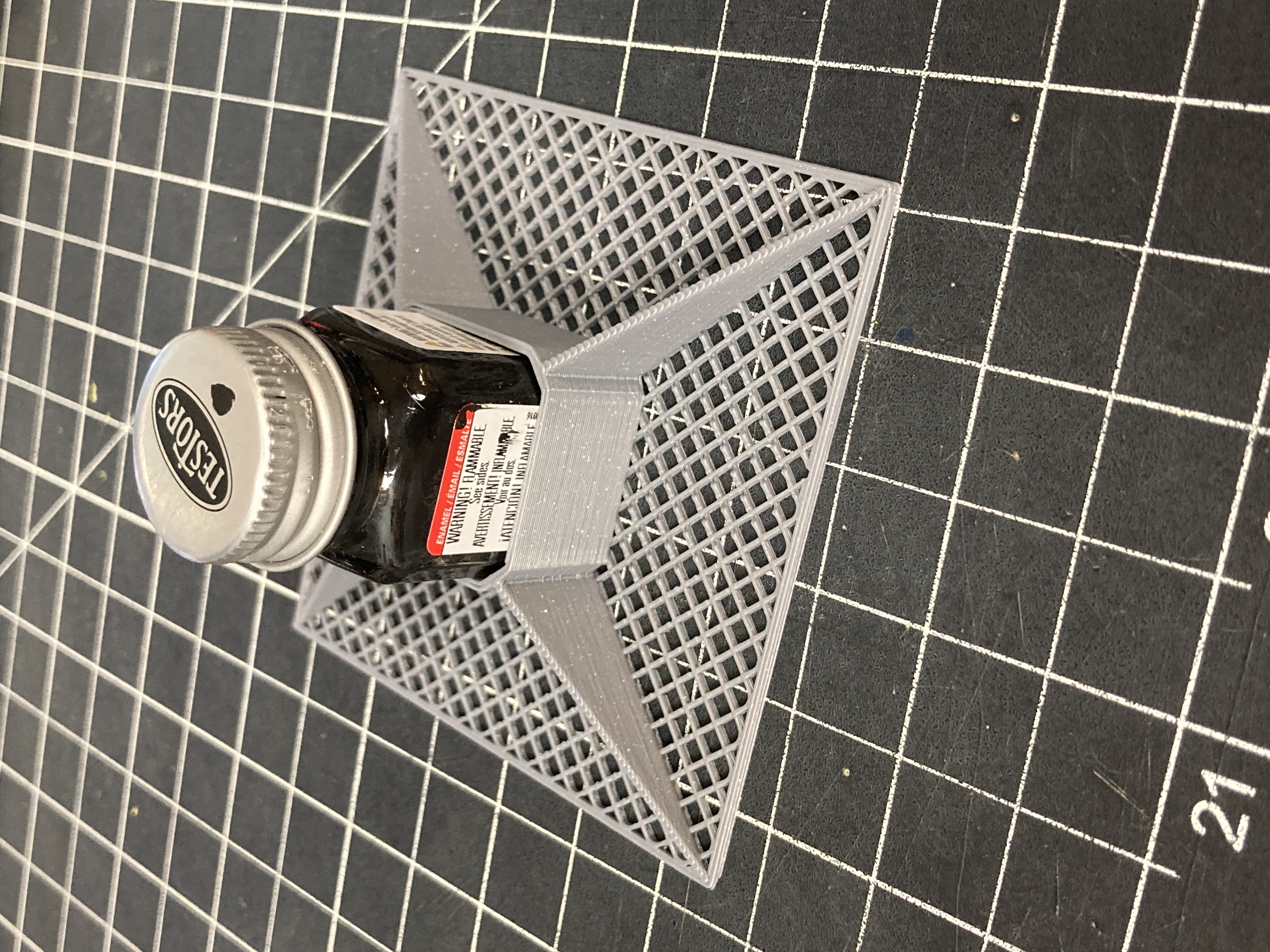 Spill prevention for small Testor's model paint bottles