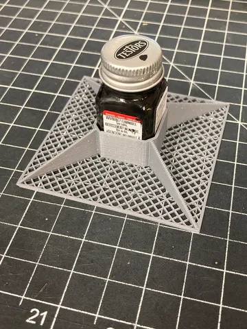 Spill prevention for small Testor's model paint bottles