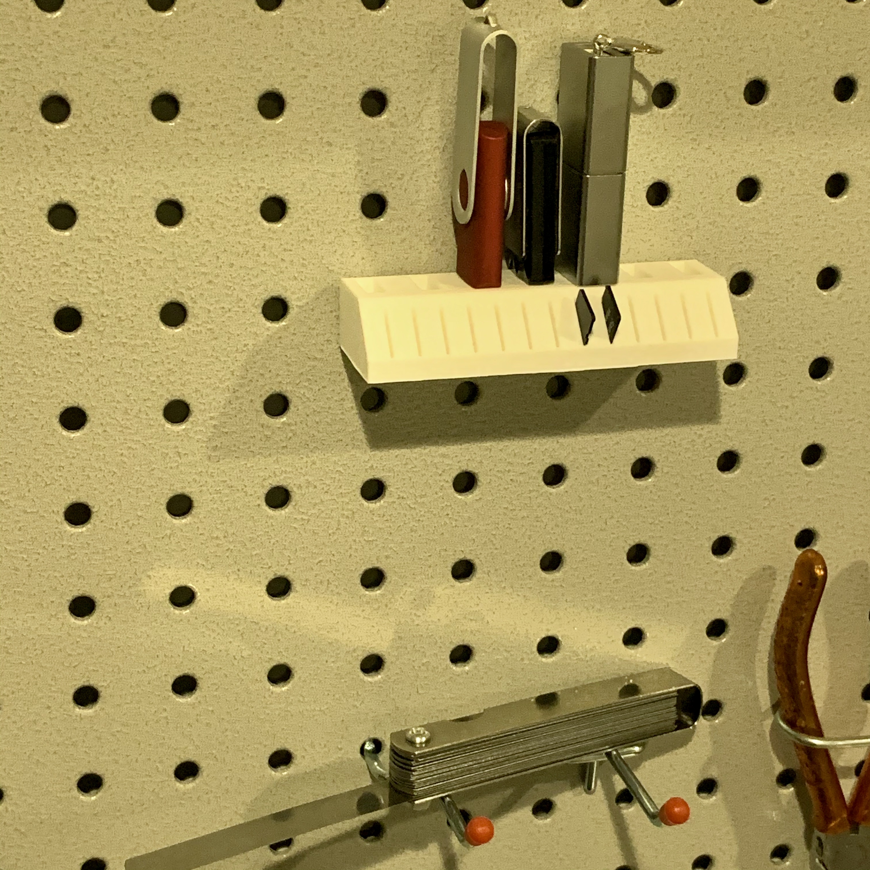 Pegboard holder for USB sticks and Micro-SD cards