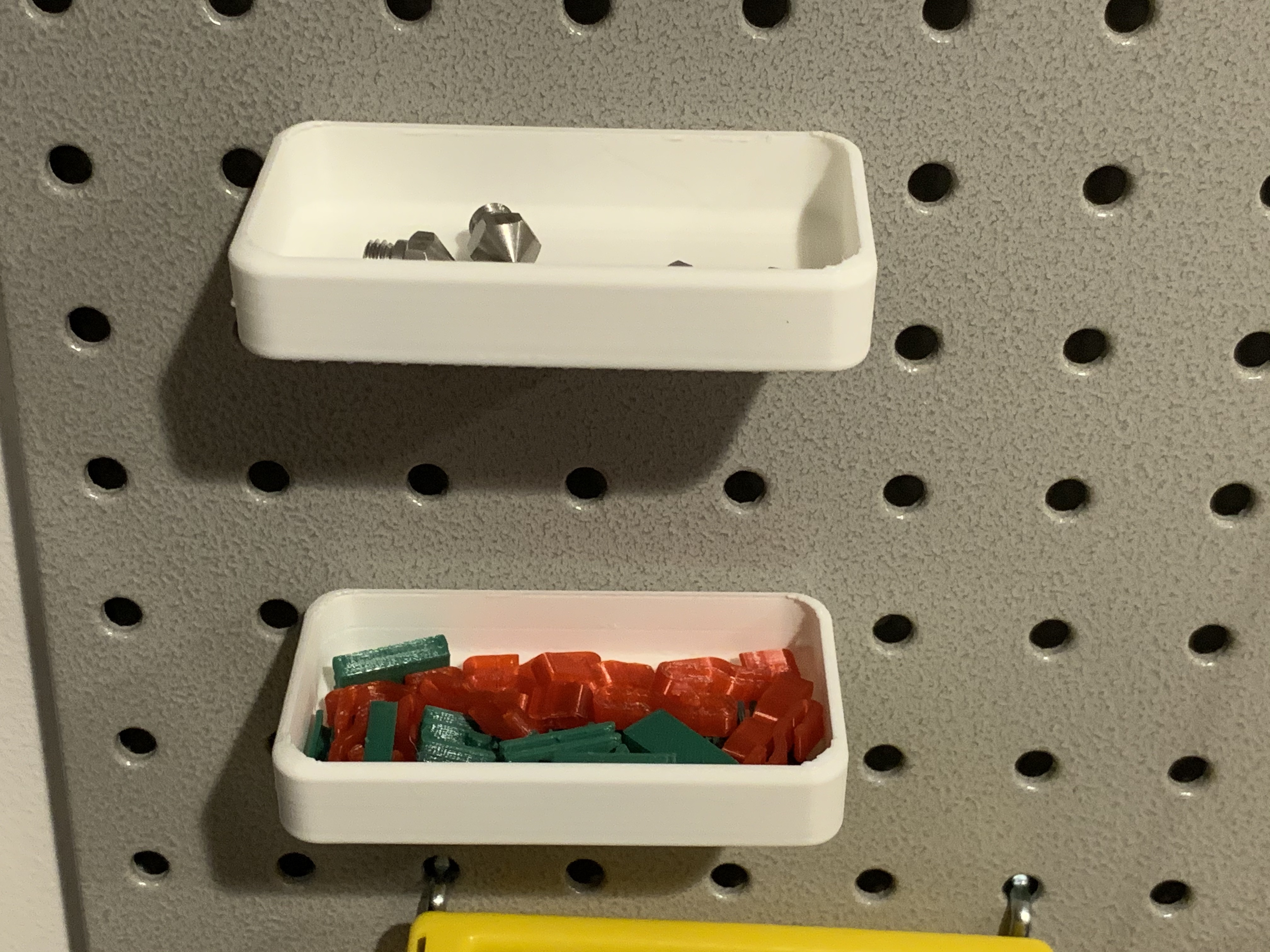 Pegboard holder for filament clips, print nozzles, and other small items