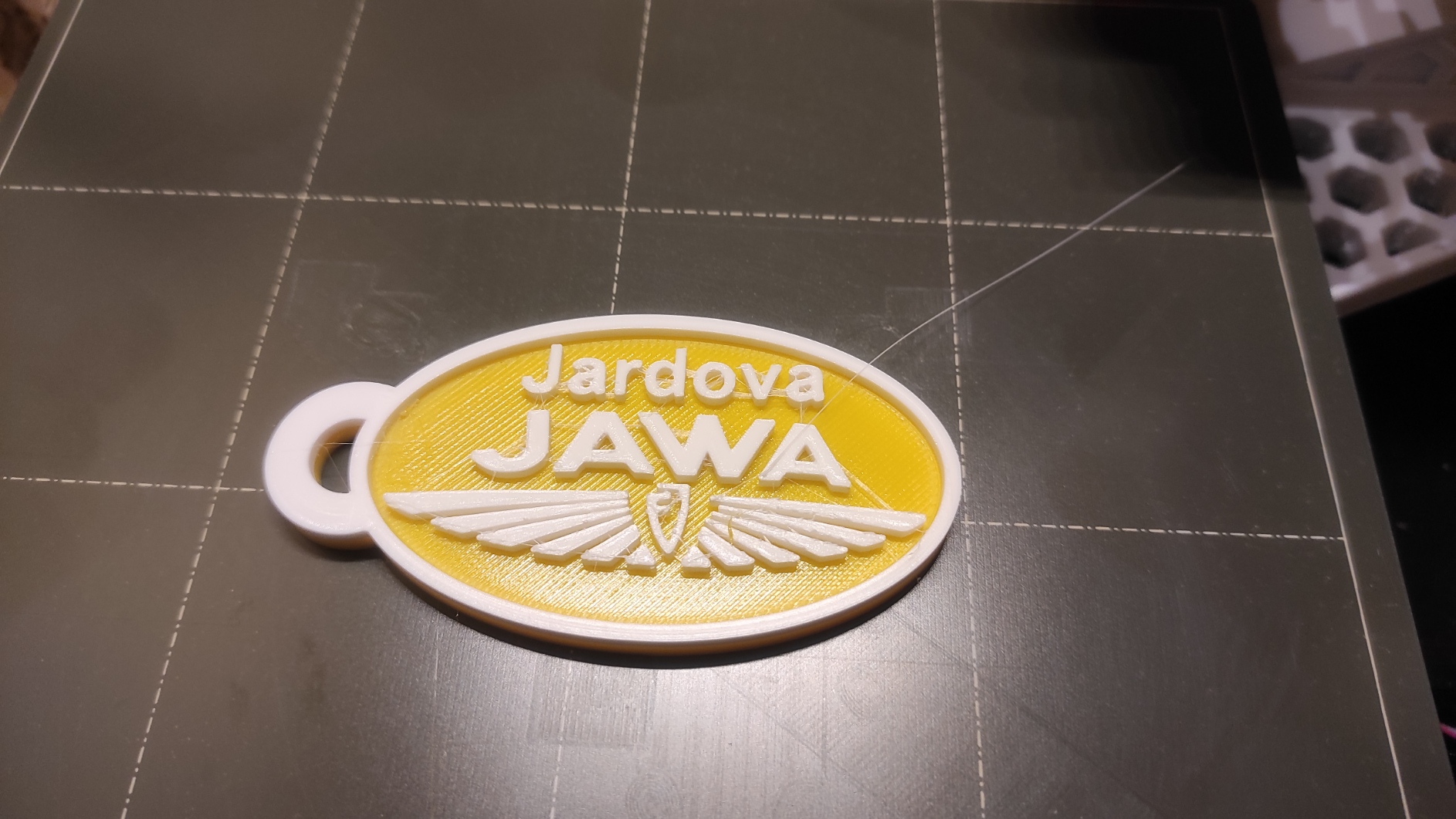 Pendant with nameplate and JAWA logo