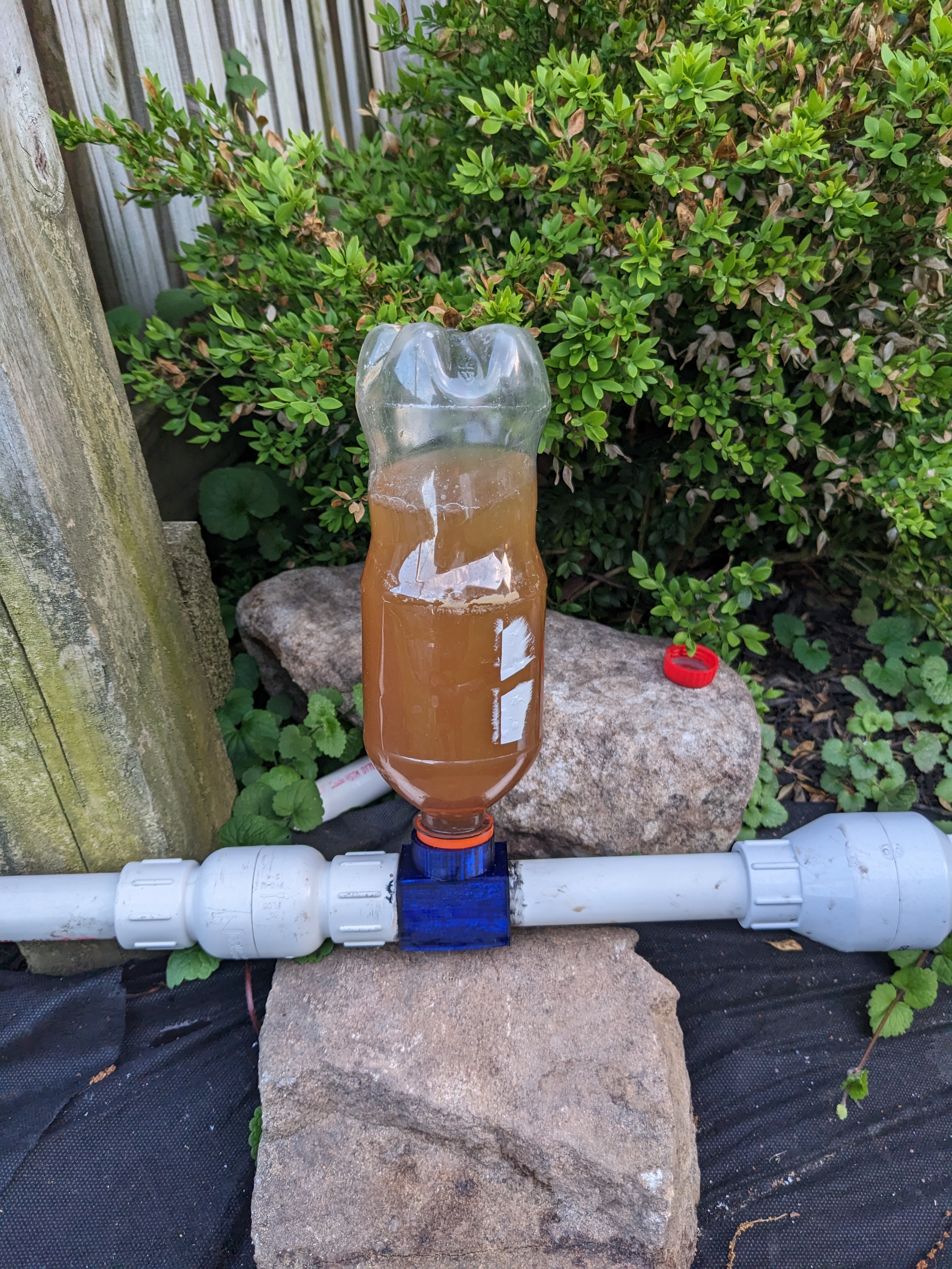 3/4 inch PVC coupler with 2 liter soda fitting for irrigation