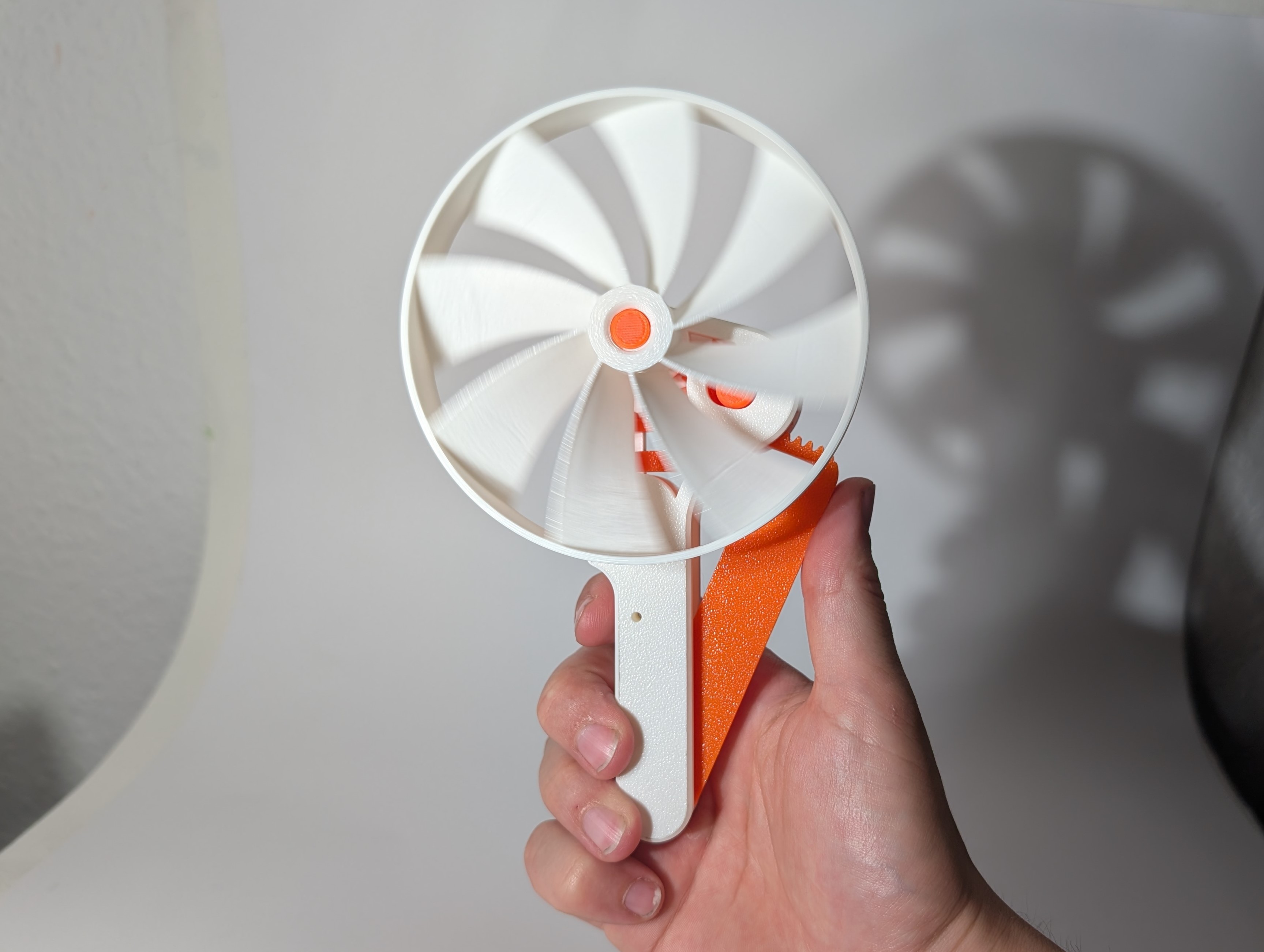 Squeeze Powered Flywheel Fan