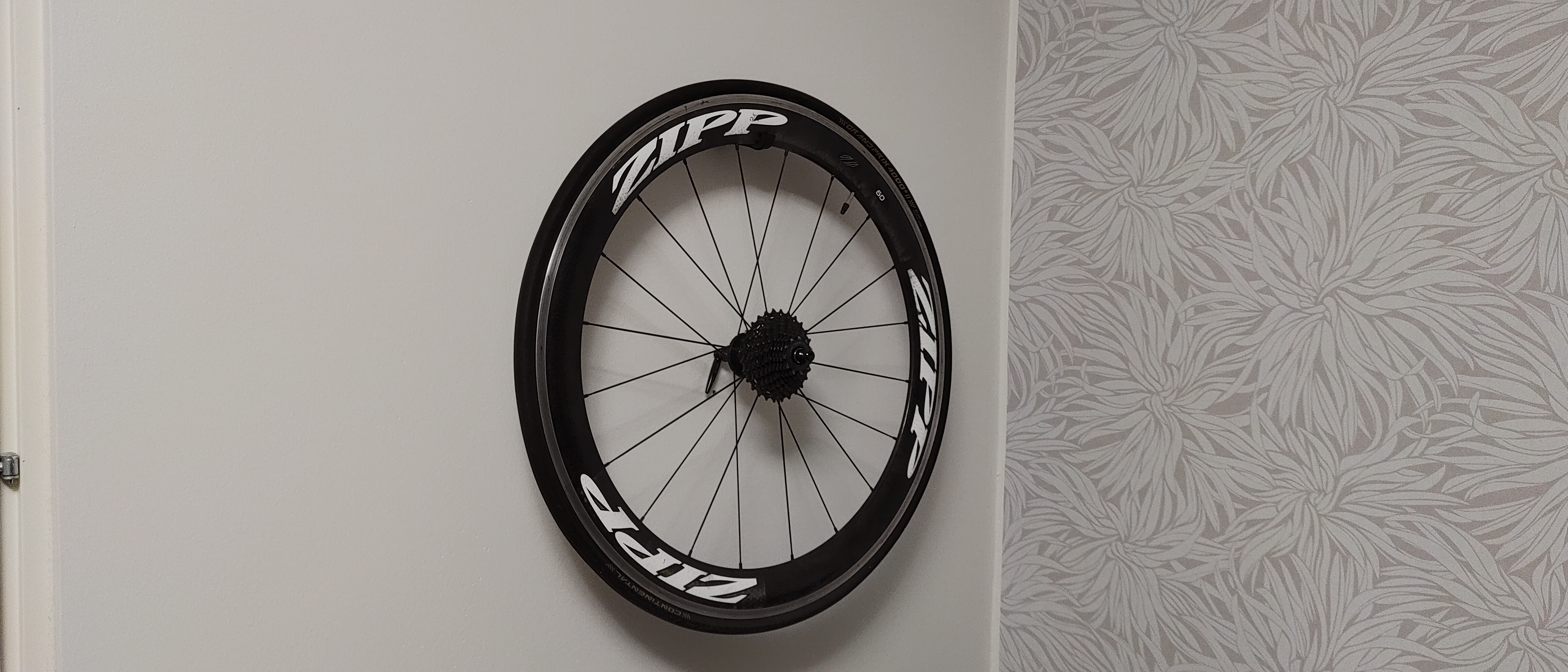 Bike wheel wall hook