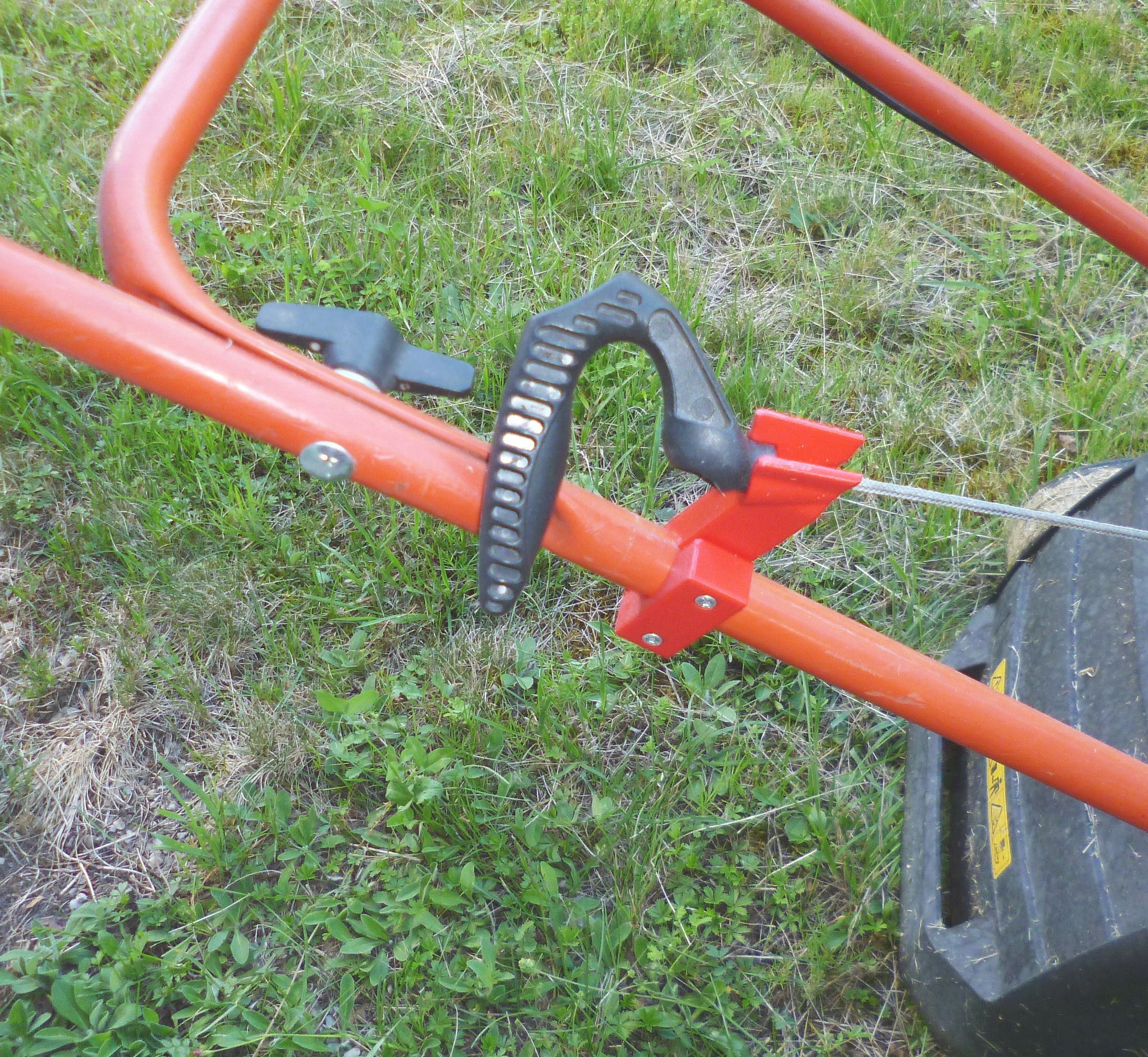 Holder for starting rope. Lawn mower.