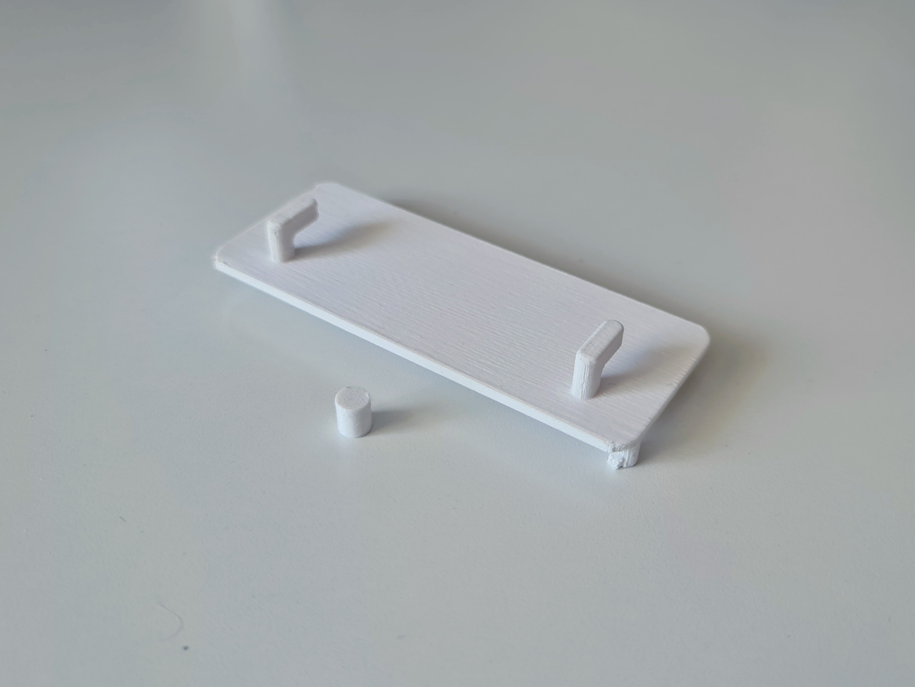 IKEA KOPPLA extension cord mount for IKEA SKADIS pegboard by Fraxinus